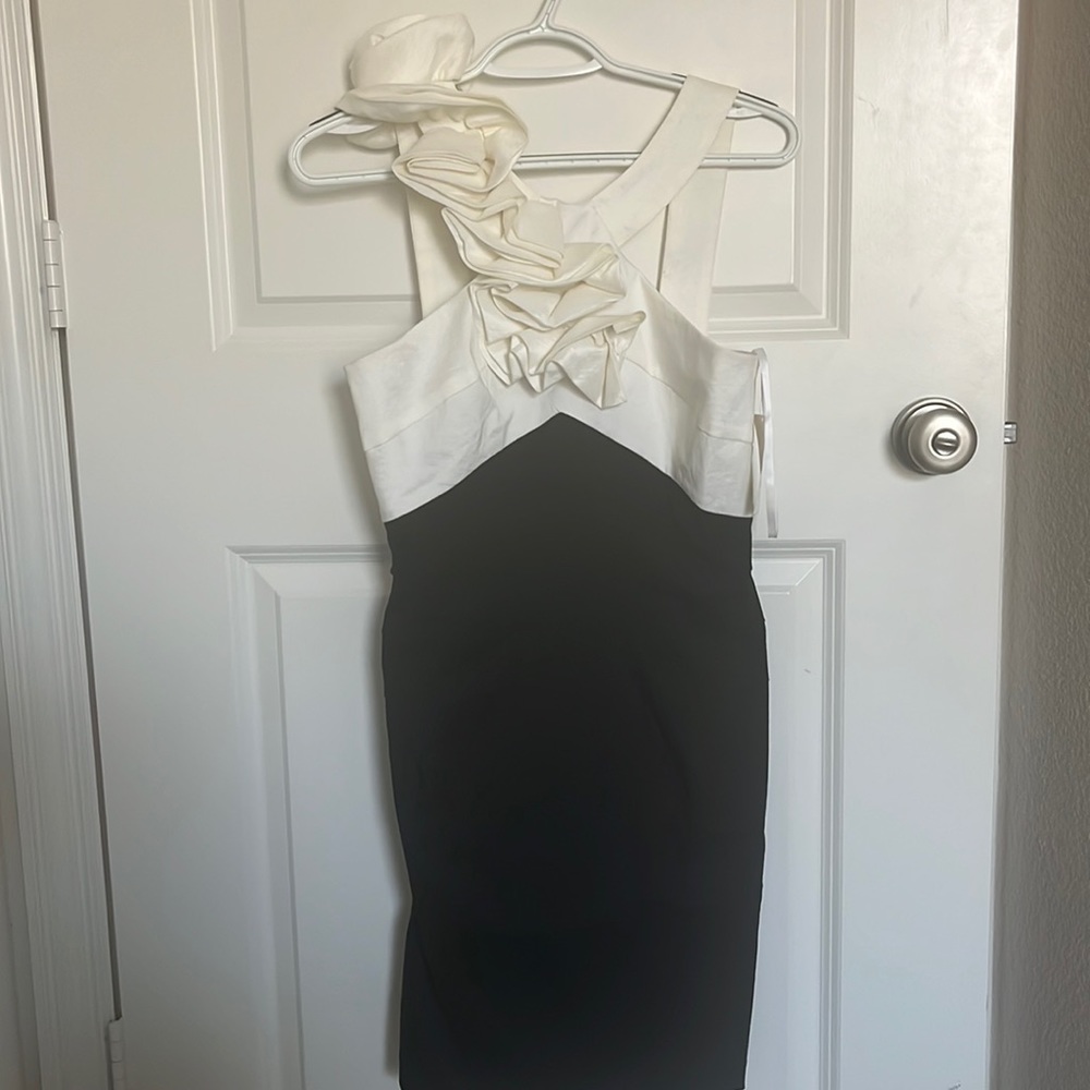 super cute, black and white dress with flower detailing throughout the front!!